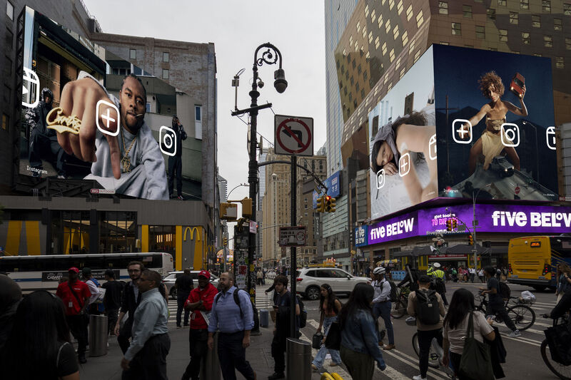 New York streetscape with Instagram Anyway campaign billboards using the Instagram upload button as the central device